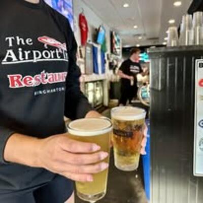 Staff holding cold beers