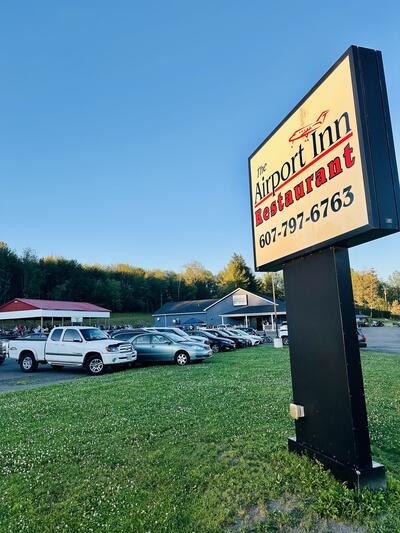 Airport Inn sign at dusk